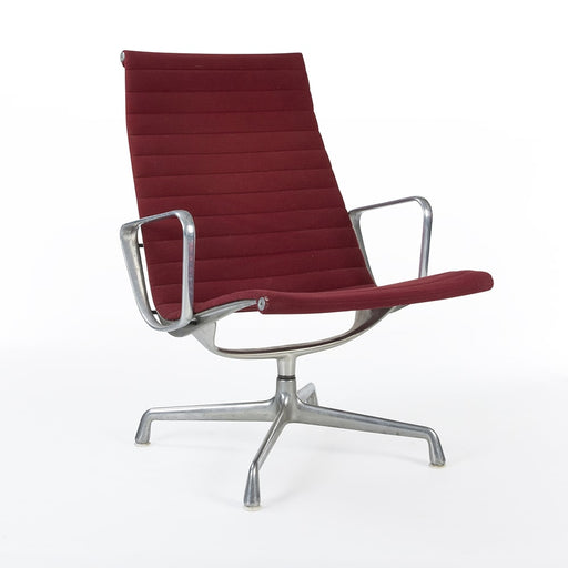 Front angled view of red Eames EA316 aluminium lounge chair