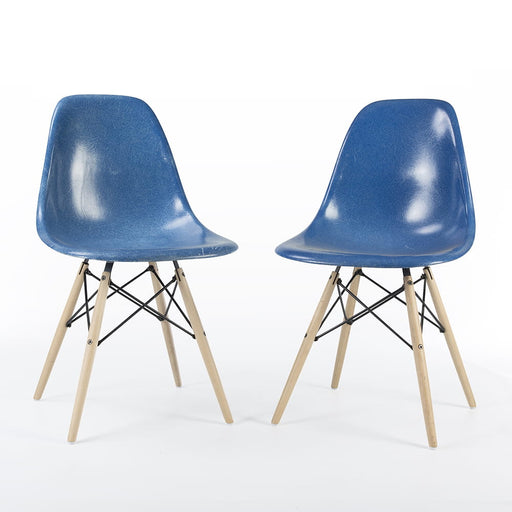 Front angled view of pair of blue Eames DSW dining side chairs