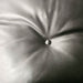 Close up view of leather on Black and Rosewood Eames Lounge Chair