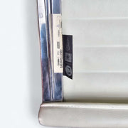 View of label on white Eames EA335 office chair