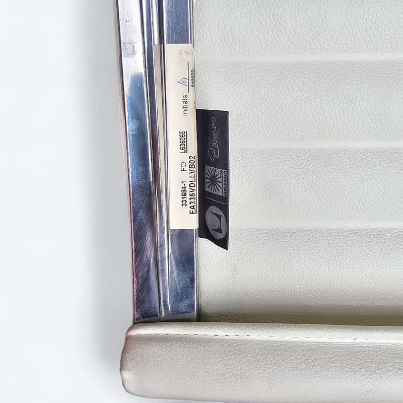 View of label on white Eames EA335 office chair