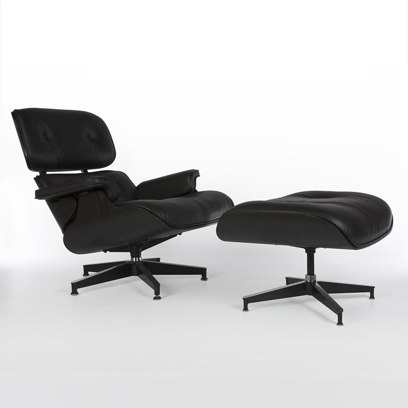 Right side angled view of all black Eames lounge chair and ottoman