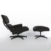 Right side view of all black Eames lounge chair and ottoman