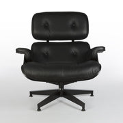 Front view of all black Eames lounge chair