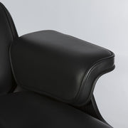Close up view of arm on all black Eames lounge chair