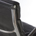 Close up rear angled view of black Eames EA437 office chair