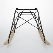Front view of light ash Eames RAR rocking base