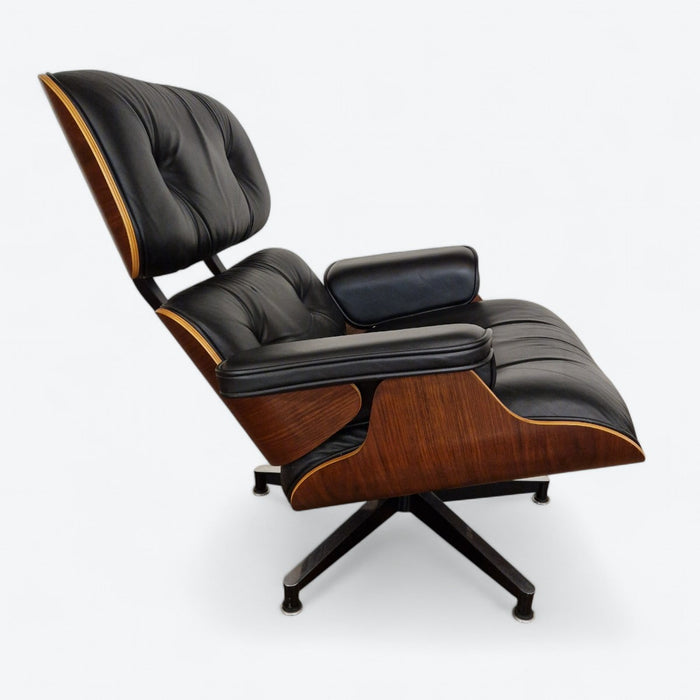 Right side view of black and walnut Eames Lounge Chair