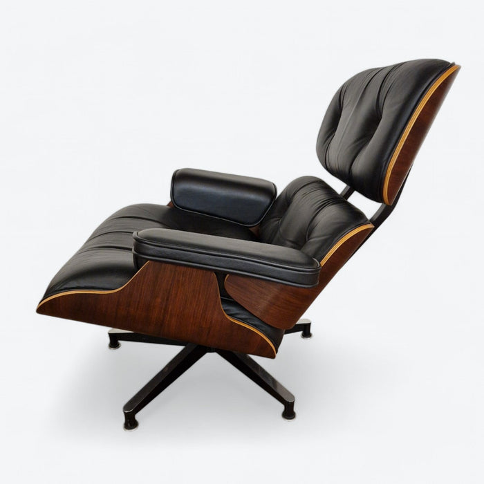 Left side view of black and walnut Eames Lounge Chair