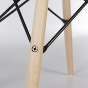 Close up view of maple Eames dowel base