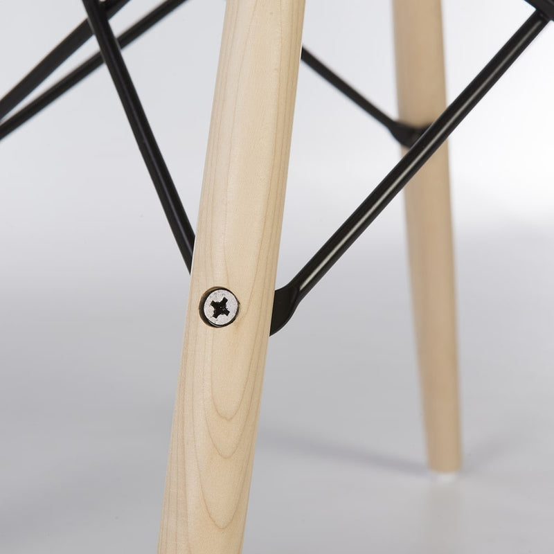 Close up view of maple Eames dowel base