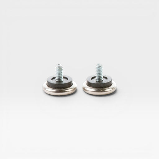 A pair of small domes of silence feet for the Eames Lounge Chair Ottoman
