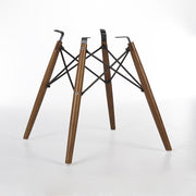 Rear angled view of light oak Eames dowel base