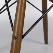 Close up view of light oak Eames dowel base