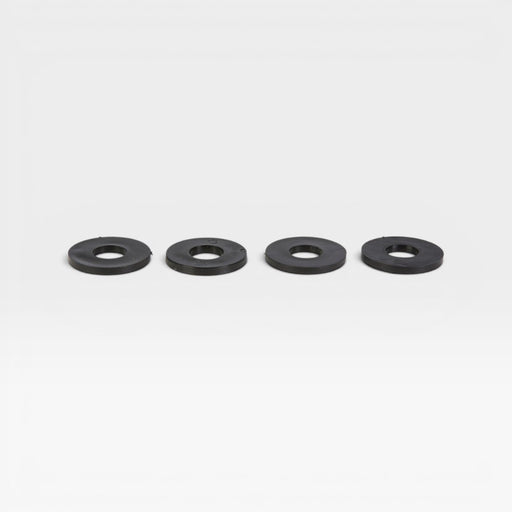 Four large black plastic washers for use on Eames upholstered fiberglass chairs