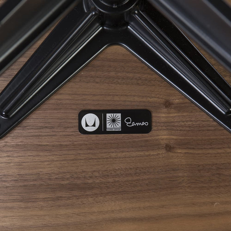 View of label on green mohair walnut Eames Lounge Chair and Ottoman