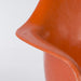 Close up view of arm on orange Eames RAR