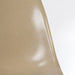 Artistic front view of greige Eames DSW dining side chair