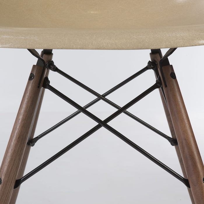 Close up base view of greige Eames DSW dining side chair