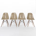 Front view of set of 4 Greige Eames DSW dining side chairs in a line