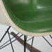 Close up front angled view of green on greige Eames RAR rocking arm chair
