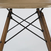 Partial view of base on tan Eames DSW