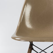 Artistic close up front view of tan Eames DSW