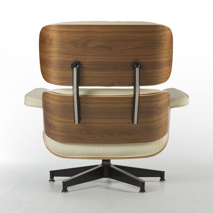 Rear view of cream and walnut Eames Lounge Chair