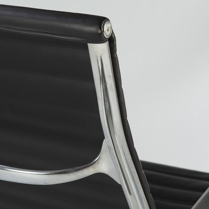 Close up rear angled view of black EA316 Eames Aluminium Lounge Chair