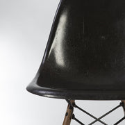 Artistic partial front view of black Eames DSW