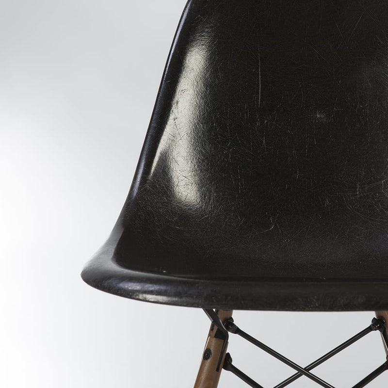 Artistic partial front view of black Eames DSW