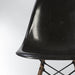 Partial front view of black Eames DSW