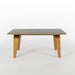 Angled side on view of black Eames Evans OTW coffee table