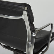 Close up rear angled view of black Eames EA435 office chair