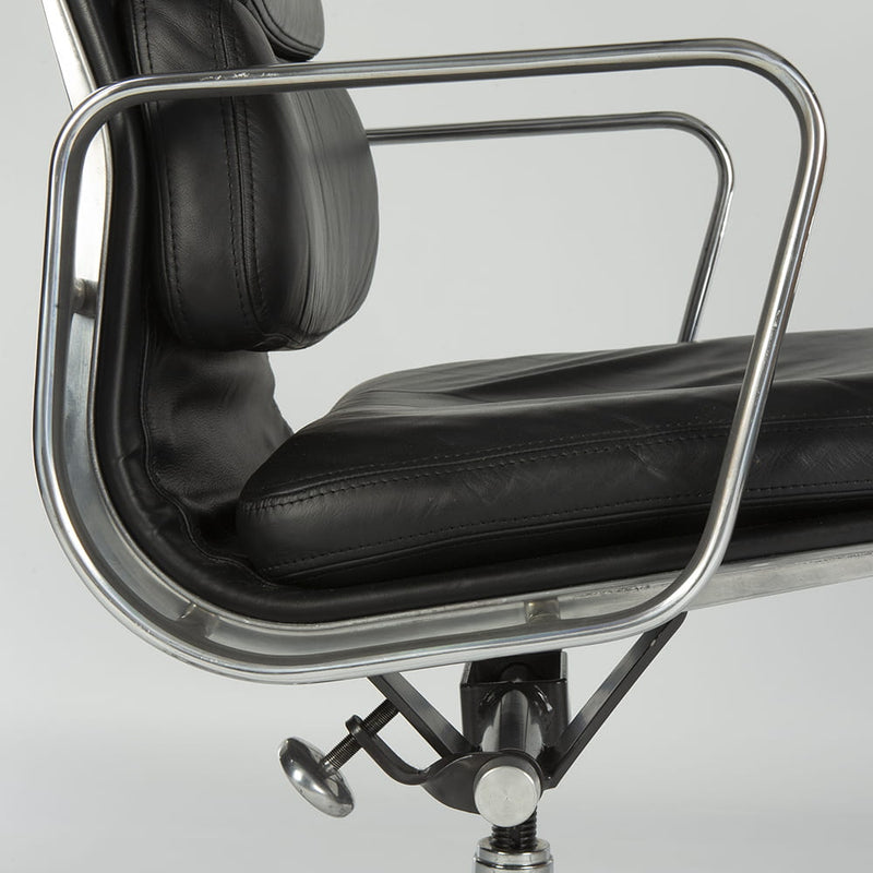 Close up right side view of black Eames EA435 office chair