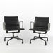 Front angled view of pair of Eames EA318 Low Back Office Chairs