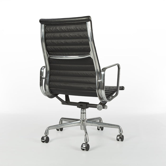 Rear angled view of black Eames EA337 office chair