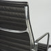 Close up rear angled view of black Eames EA337 office chair