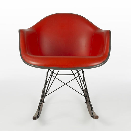 Front view of red Eames RAR rocking arm chair