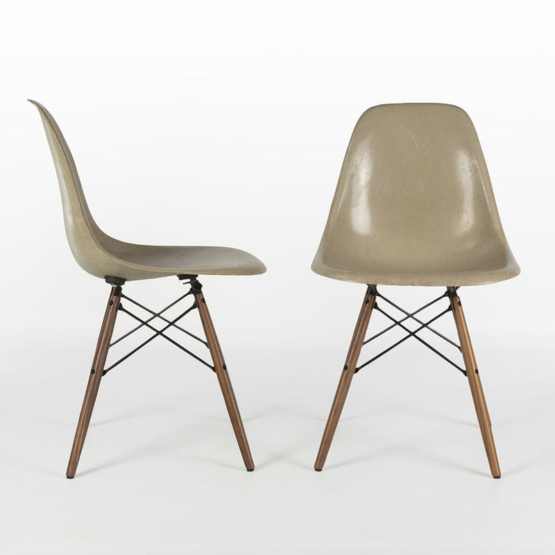 View of pair of greige Eames DSWs, one from right, one from front