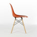 Right side view of orange Eames DSW dining side chair