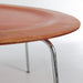 Close up partial view of red Eames CTM coffee table