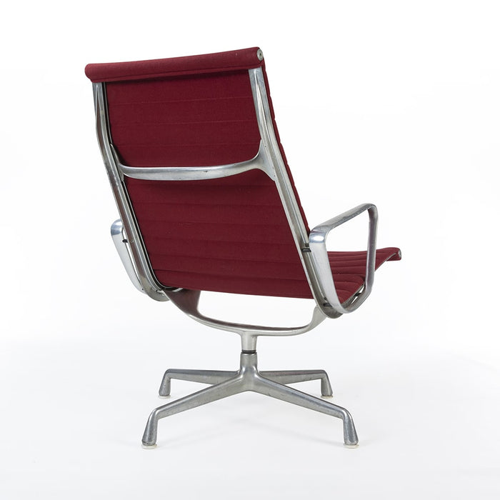 Rear angled view of red Eames EA316 aluminium lounge chair