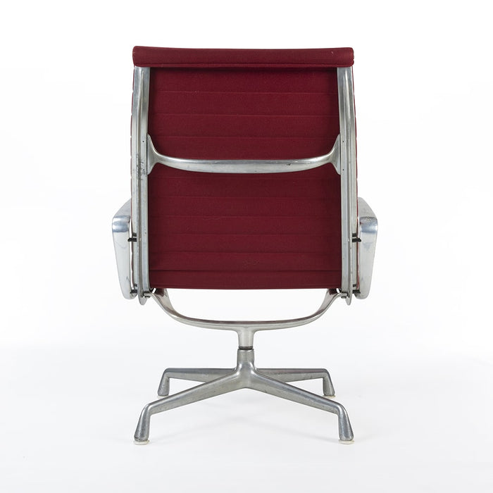 Rear view of red Eames EA316 aluminium lounge chair
