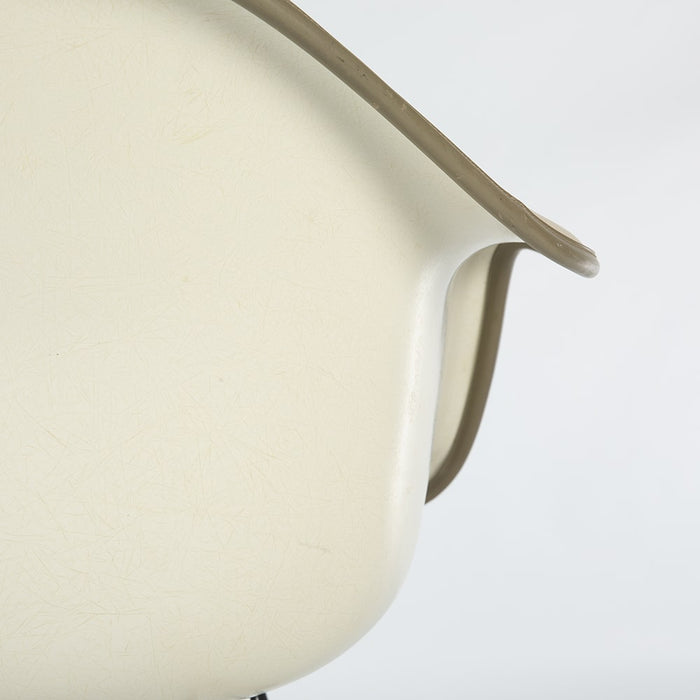 Close up rear view of all white Eames RAR rocking arm chair