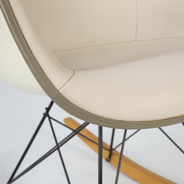 Close up front angled view of all white Eames RAR rocking arm chair