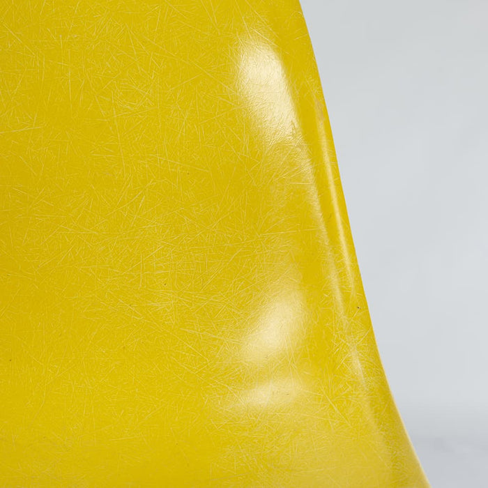 Close up front view of Bright Yellow Eames DSW dining side chair