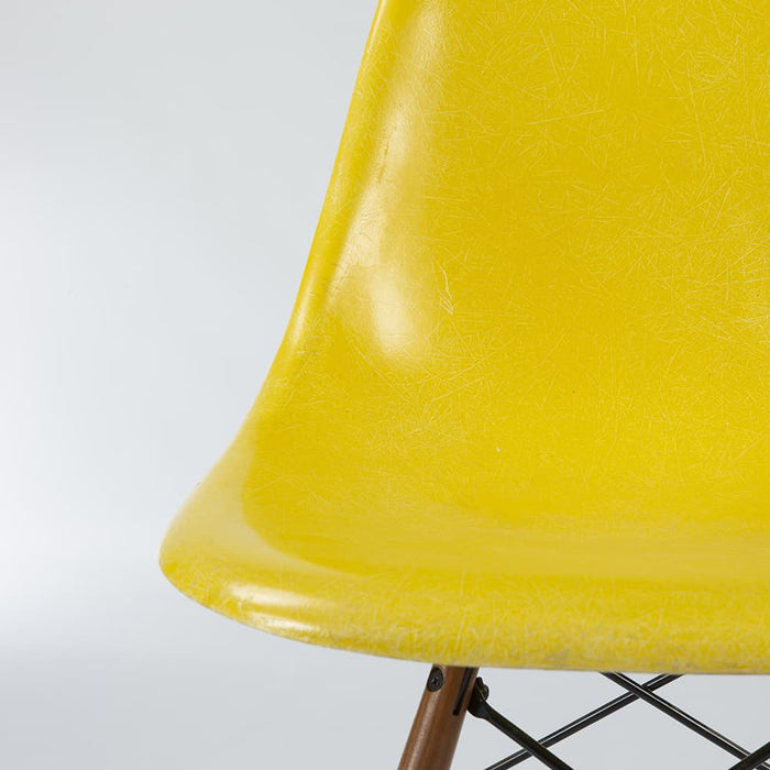 Artistic front view of Bright Yellow Eames DSW dining side chair