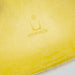 View of logo on Bright Yellow Eames DSW dining side chair