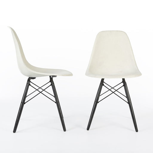 Front view of pair of white Eames DSWs, one from right side, one from front